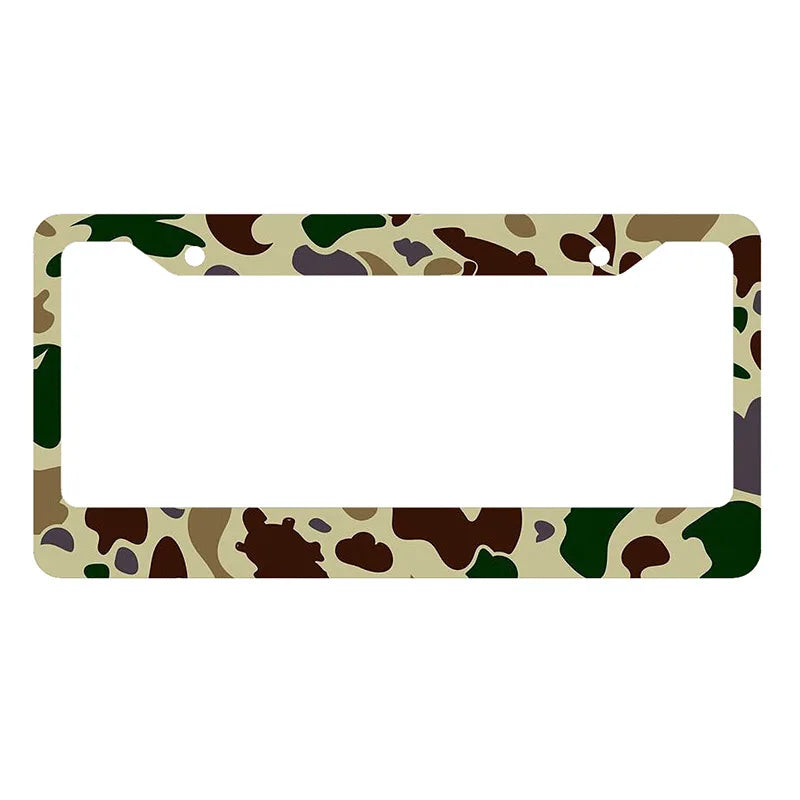 A rectangular license plate cover featuring a camouflage pattern of green, brown, and tan colors.