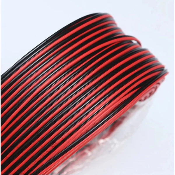 A coil of red and black high flexibility LED power cords viewed from above.