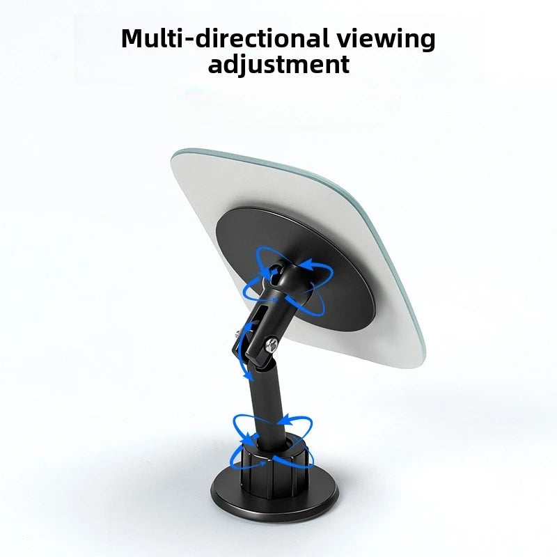 A white and black multi-directional viewing adjustment mirror for blind spot assistance.