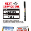 Stickers reminding users of their next service due date, mileage, and grade for an oil change.