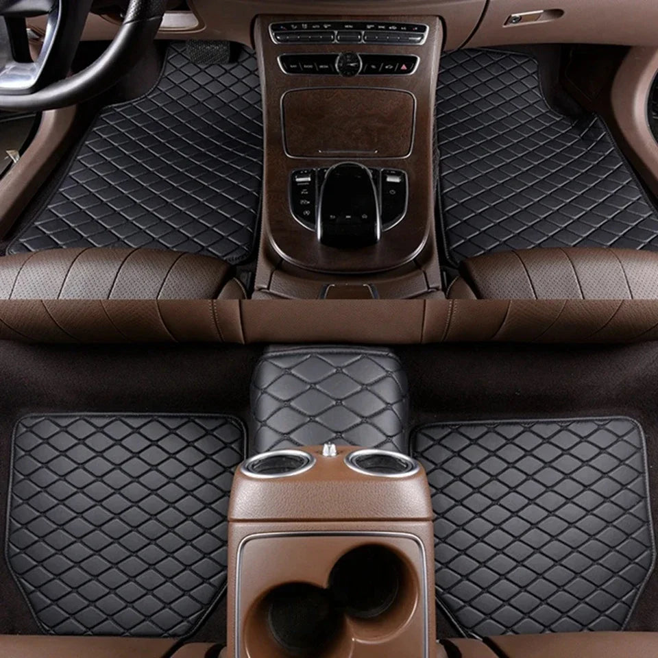 Interior view of a car with dark brown quilted floor mats and leather seats.