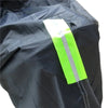 A bright neon yellow waterproof cover for a motorcycle or scooter is shown folded on a dark fabric.