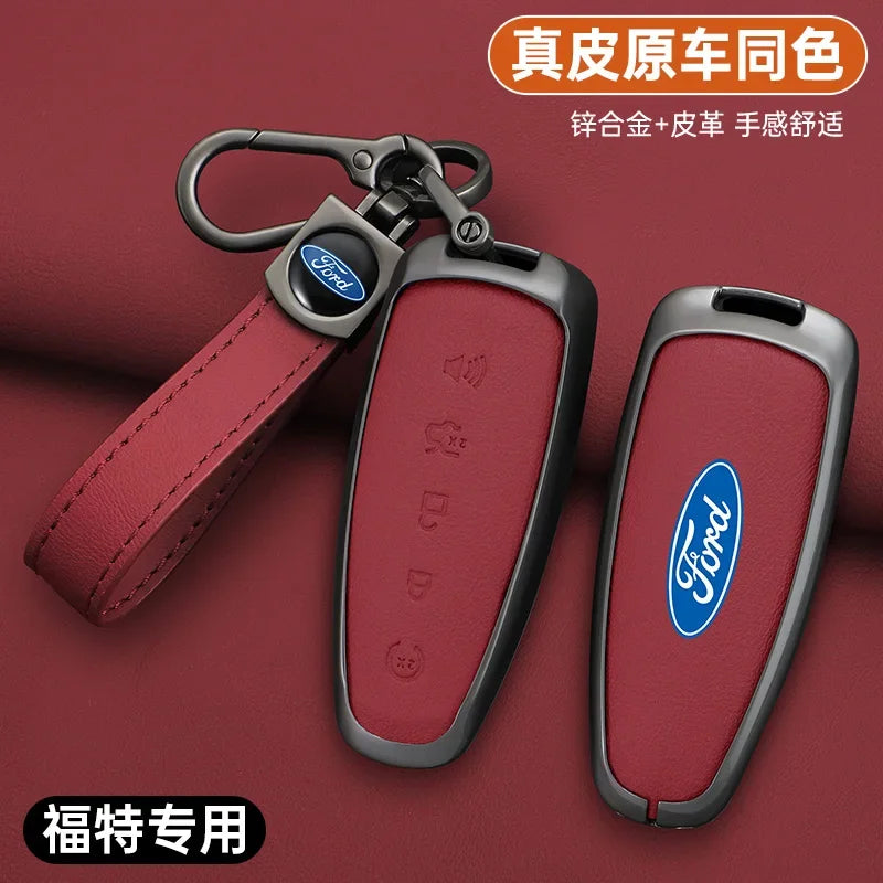 A set of red Ford car key covers made of zinc alloy and leather, shown against a maroon background.