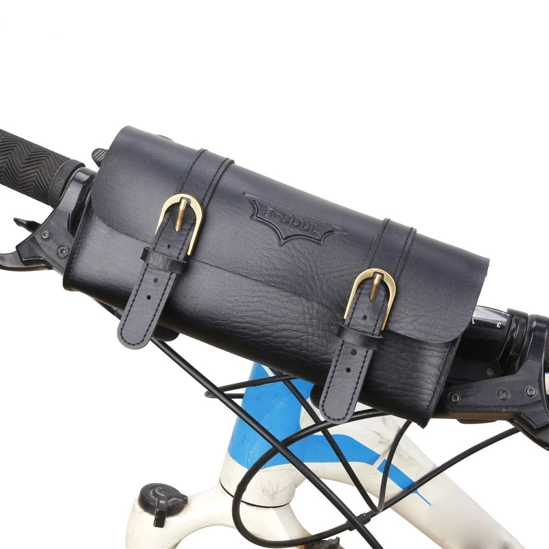 A black premium PU leather motorcycle handlebar saddlebag attached to a white and blue bicycle frame.