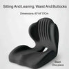 Black ergonomic shell seat cushion designed for sitting and leaning with lumbar support.