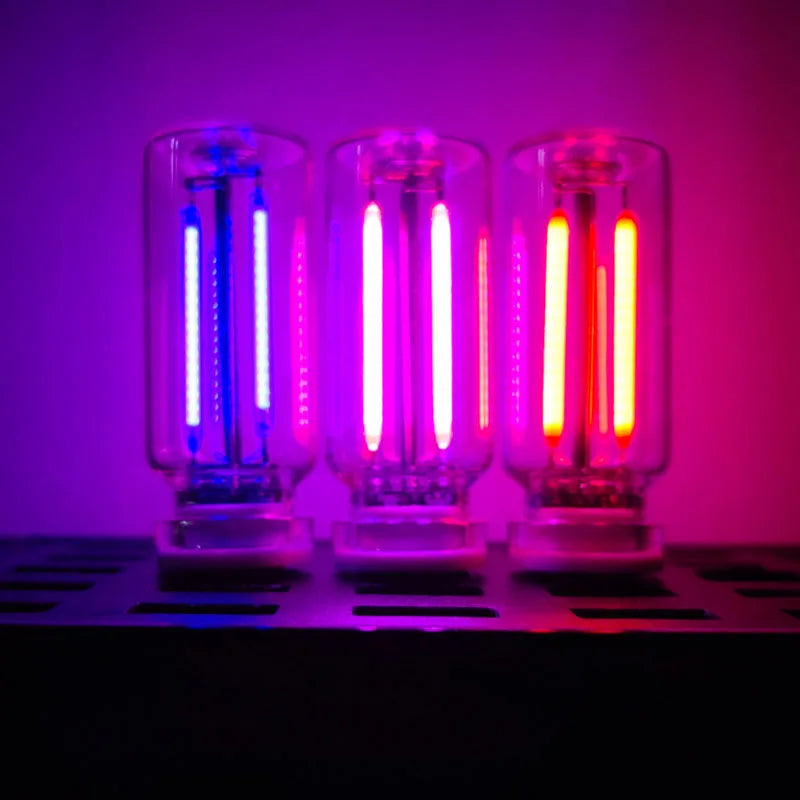 Three glass tubes of USB touch dimmable LED night lights glowing blue, purple, and red against a dark background.