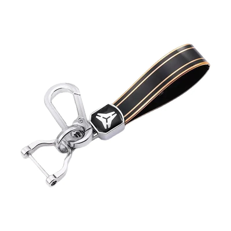 A black and gold TPU car key case cover for multiple vehicles.