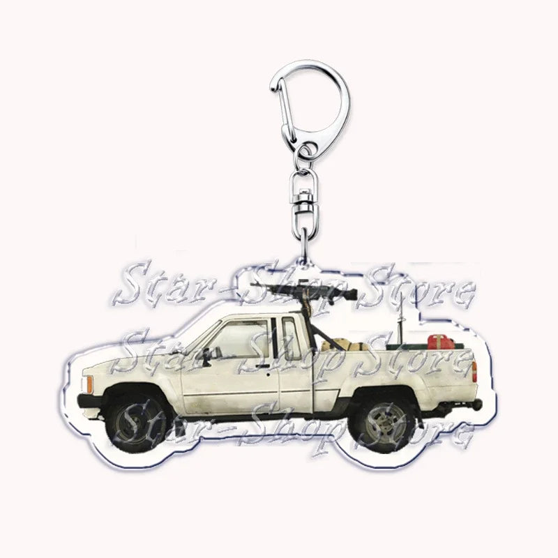 Silver acrylic keychain featuring a white off-road pickup truck.