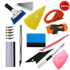 A kit of various tools for car vinyl tint film installation, including blades, cutters, and specialized tools.