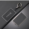 Support de protection NFC noir avec anneau métallique, montré sur fond sombre.