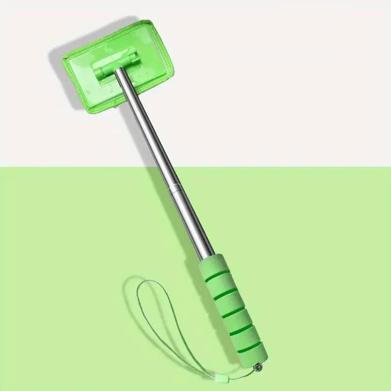 A bright lime green telescopic windshield cleaning brush with a handle and cleaning head against a light green background.