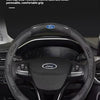 A black carbon fiber steering wheel cover for a Ford vehicle interior.