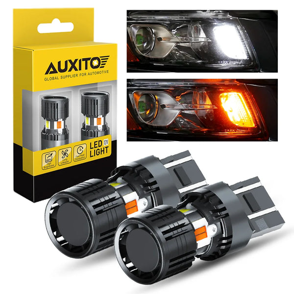 A set of universal dual color LED turn signals with clear lenses and black housing shown next to its packaging.