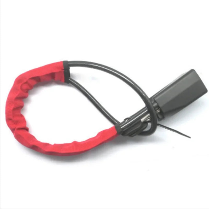 A red anti-theft device with a black cord and a gray module for locking a vehicle's steering wheel or seat belt.