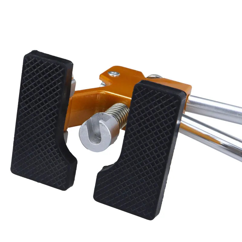 A professional car dent repair puller kit featuring an orange metal frame and two black plastic puller jaws.