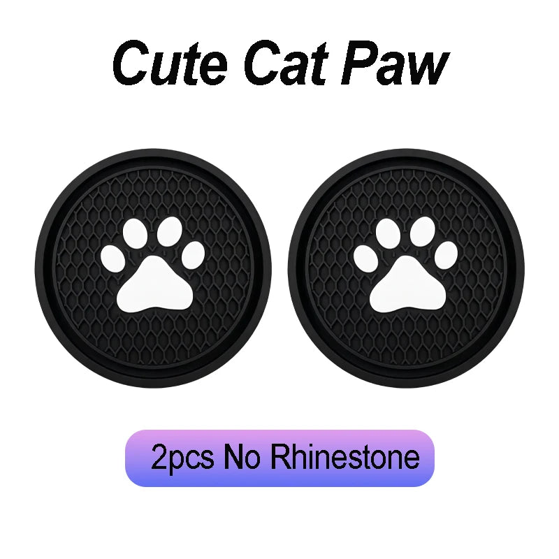 Two black silicone cat paw shaped coasters for car cup holders