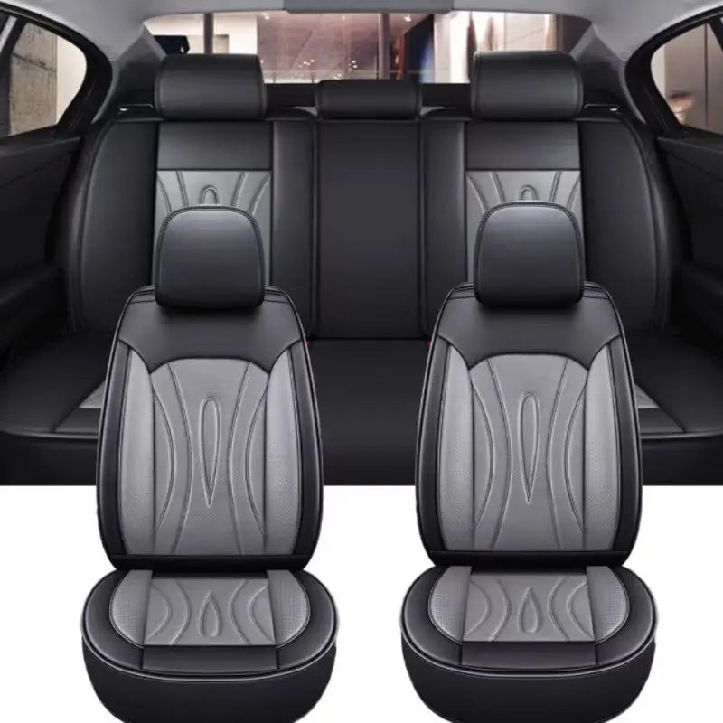 Black premium PU leather car seat covers shown in a vehicle interior view.