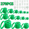 A collection of green rubber O-rings and gaskets for automotive air conditioning systems.