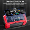 A red and black intelligent pulse repair charger with a large LED display is shown on a dark surface.