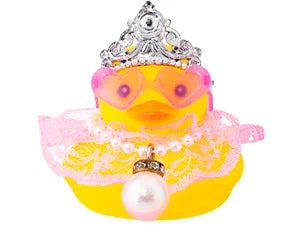 A decorative rubber duck in yellow with a crown and pink accessories.