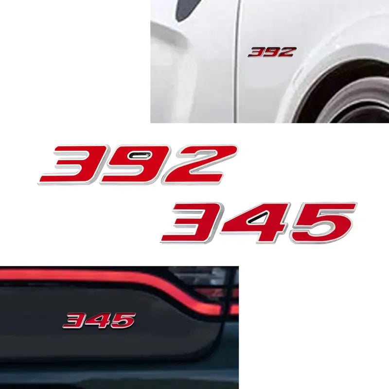 Close-up view of a white car fender with 392 and 345 decals on the side.