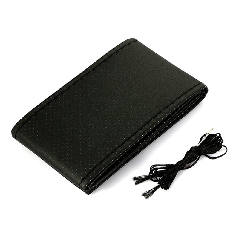 Black faux leather steering wheel cover with a black drawstring and sewing kit.