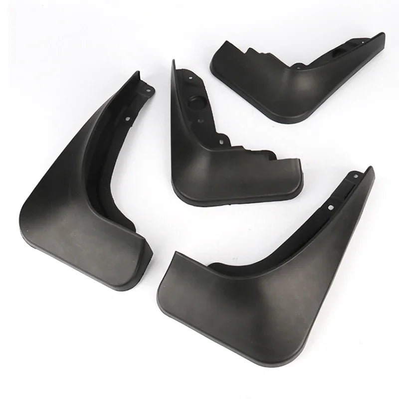 A set of black universal mud flaps for car wheel protection, shown in various angles.