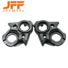 A pair of black and silver aluminum ignition switch covers for electric dirt bikes.