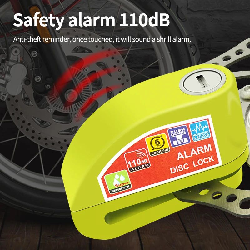 A yellow anti-theft disc lock alarm device is shown next to a bicycle wheel.