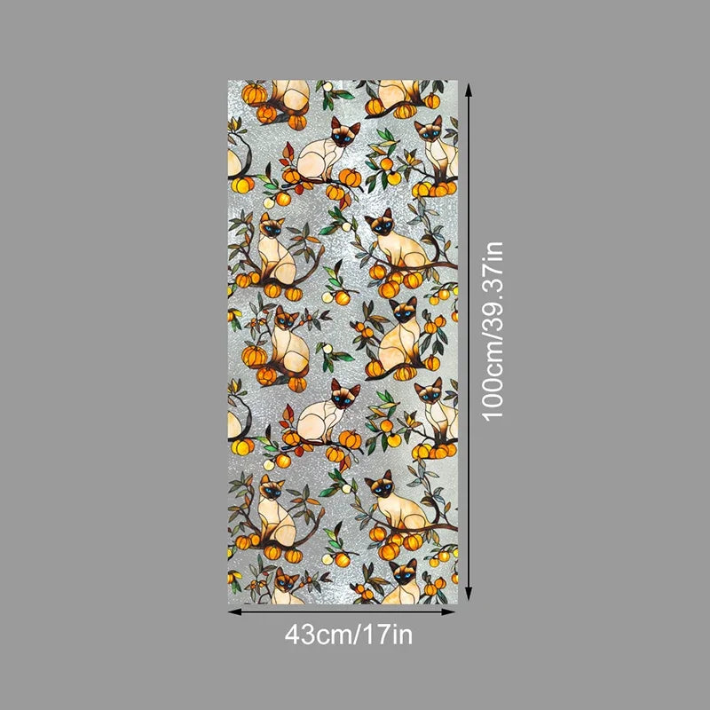 Decorative PVC stained glass window film featuring stylized cats and foliage in warm orange and green tones