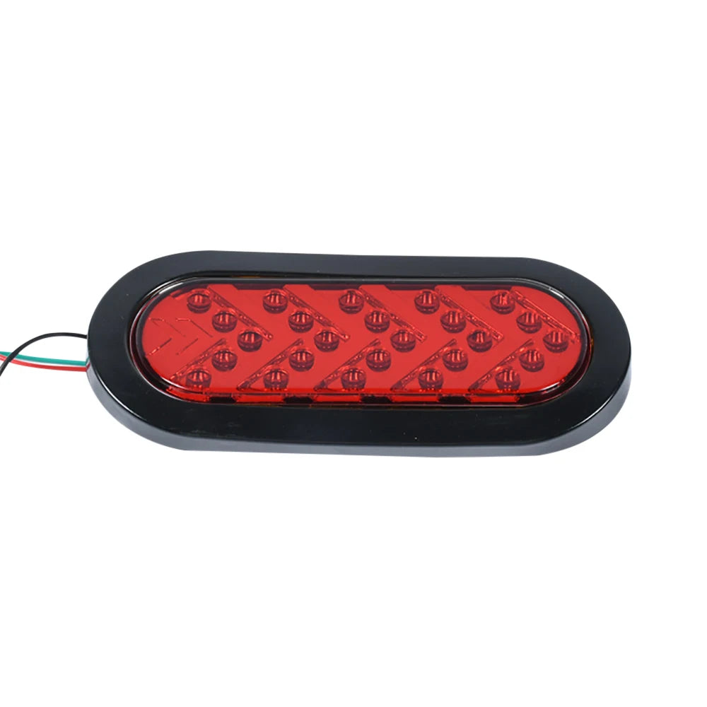 A black LED tail light assembly with multiple red lenses for trucks and trailers.