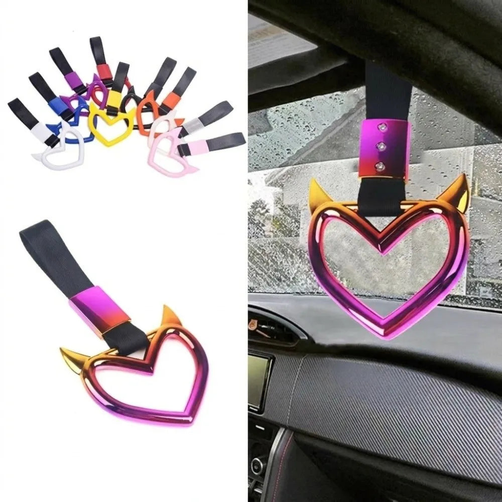 A collection of holographic heart-shaped car handle accessories in various colors and finishes.