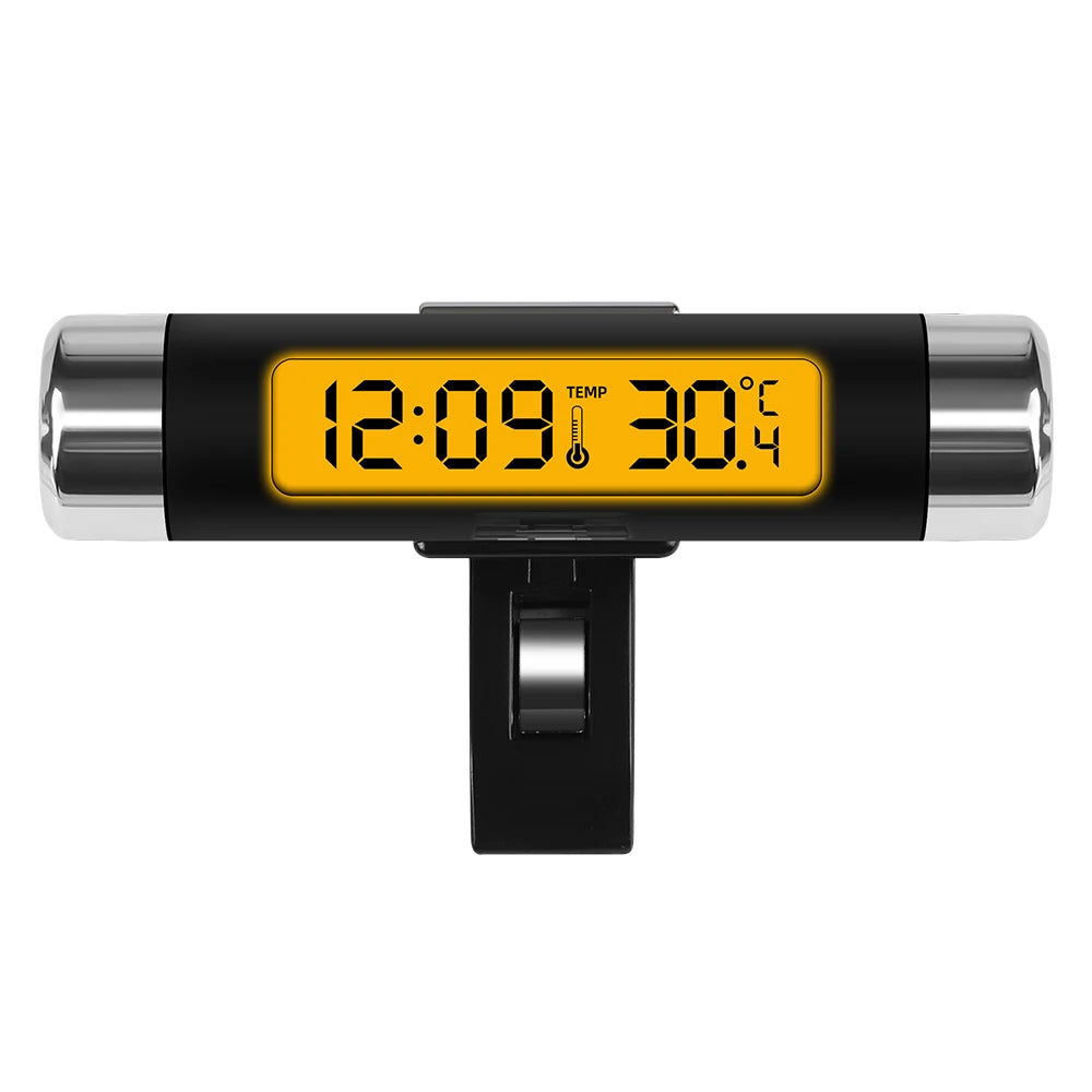 A black digital clock and thermometer with an orange display showing 12:09 and 30.4 degrees.