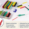 A clear plastic box containing various colored heat shrink tubing and a green electrical connector wire.