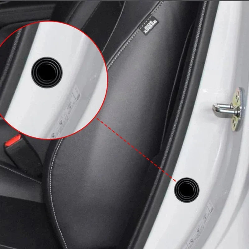 Close-up view of a car door showing anti-shock silicone pads used for soundproofing and vibration dampening.