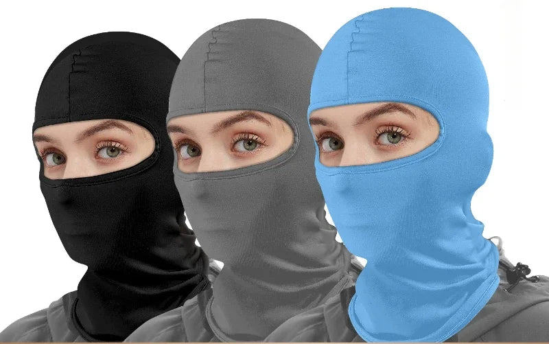 Three models wearing different colored balaclava face masks for motorcycling