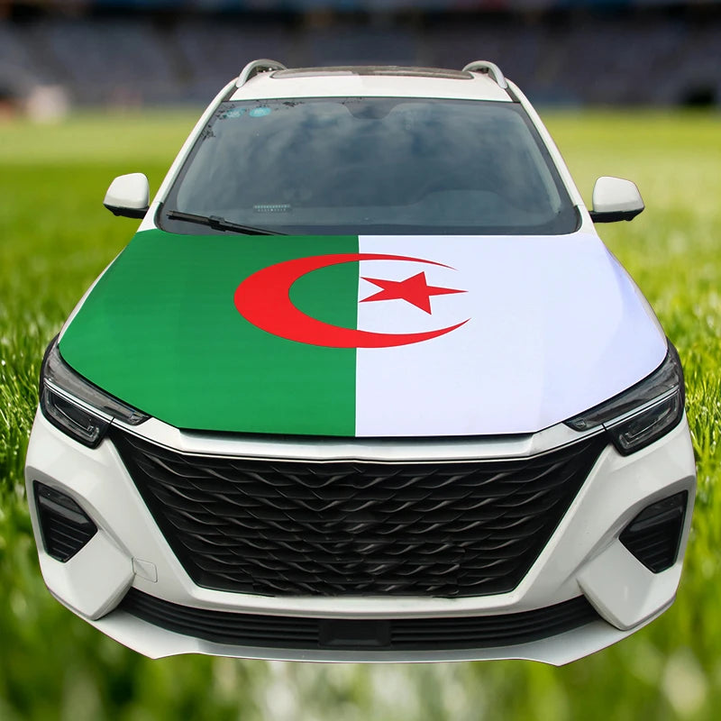 A white car with a green, white, and red flag decoration on the hood.