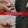 A hand uses a screwdriver to screw a tire sealant nail into a tire hole.