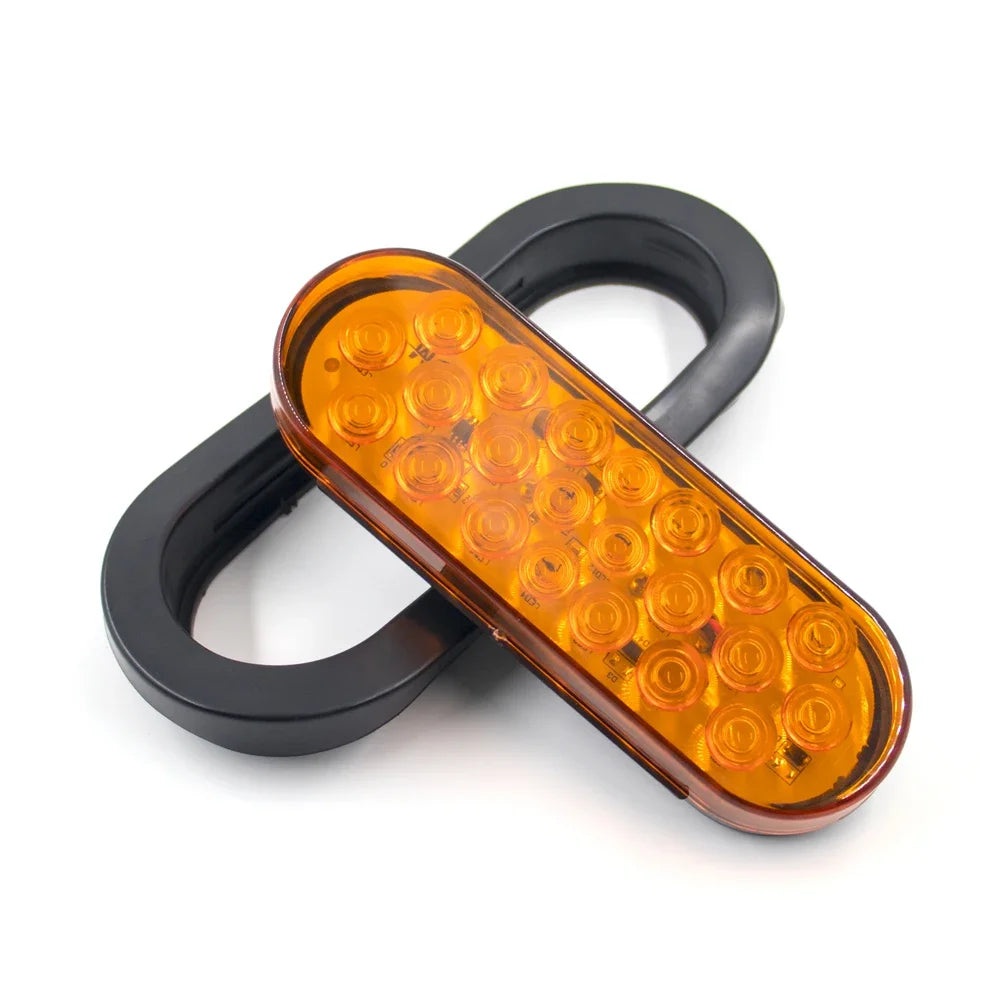 A universal LED brake and marker light assembly with a black housing and amber lens.