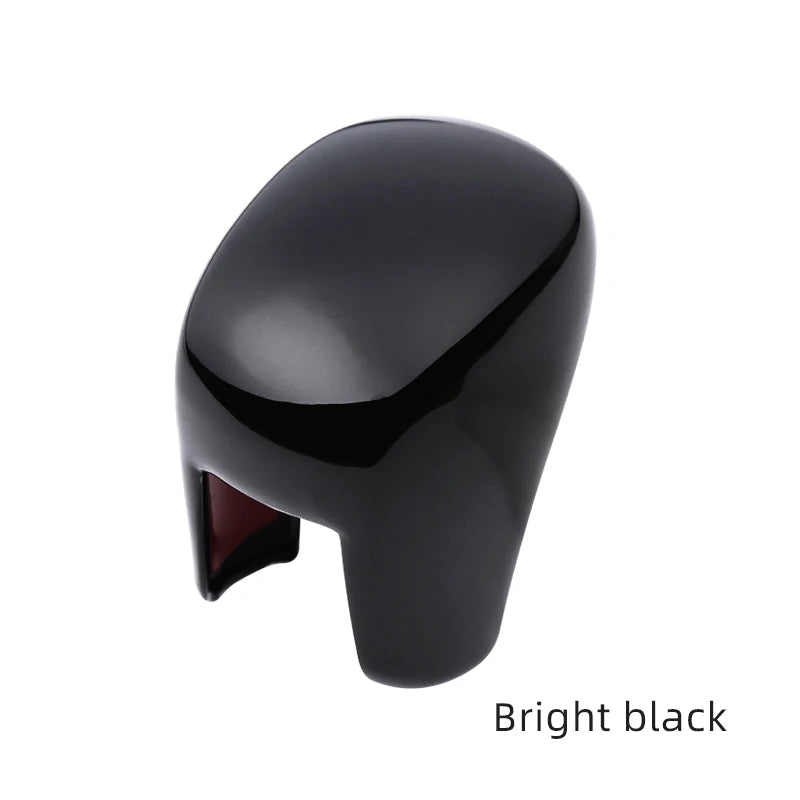 A glossy black interior knob gear protection cover for a Honda vehicle.