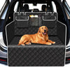 A golden retriever lies comfortably in a black pet trunk liner installed in the back of a car.