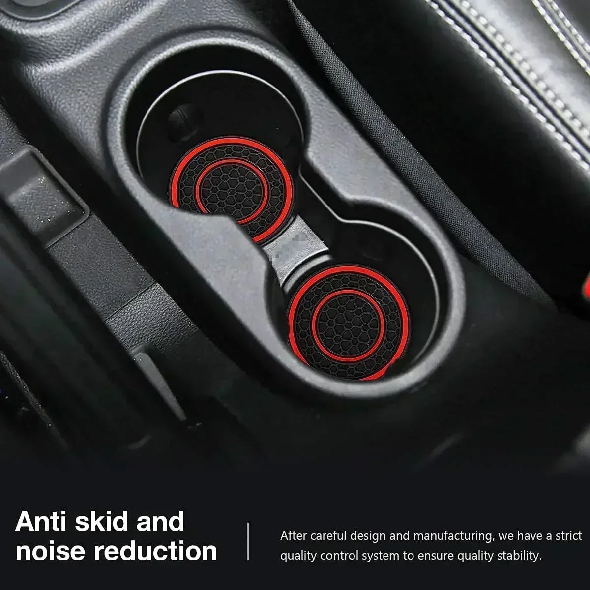 Close-up view of a black car cup holder with two red silicone coasters installed.