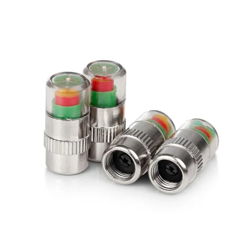 Trois bouchons de valve de moniteur de pression de pneus montrant des composants internes de couleurs différentes.