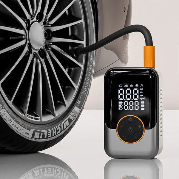 A wireless portable tire inflator is shown next to a car wheel, demonstrating its use for inflating tires.