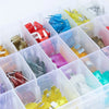 Assortment kit of blade fuses for automotive stored in clear plastic containers.