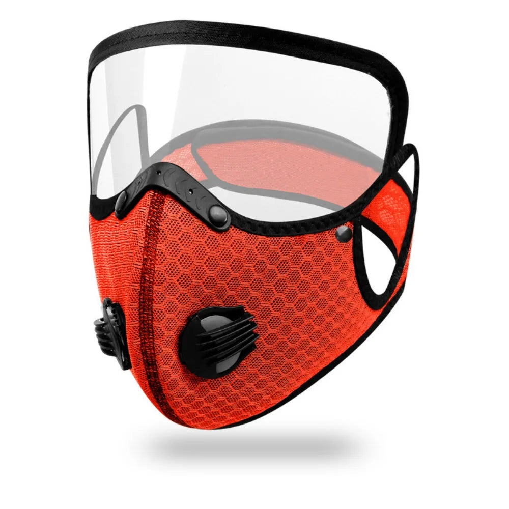 An orange mesh face mask with a clear visor and black trim for cycling or outdoor use.