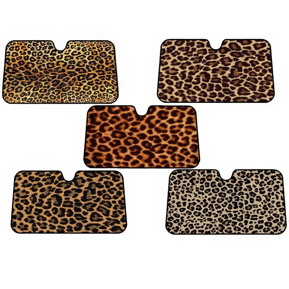 Four square leopard print car sunshades in various shades of brown and black.