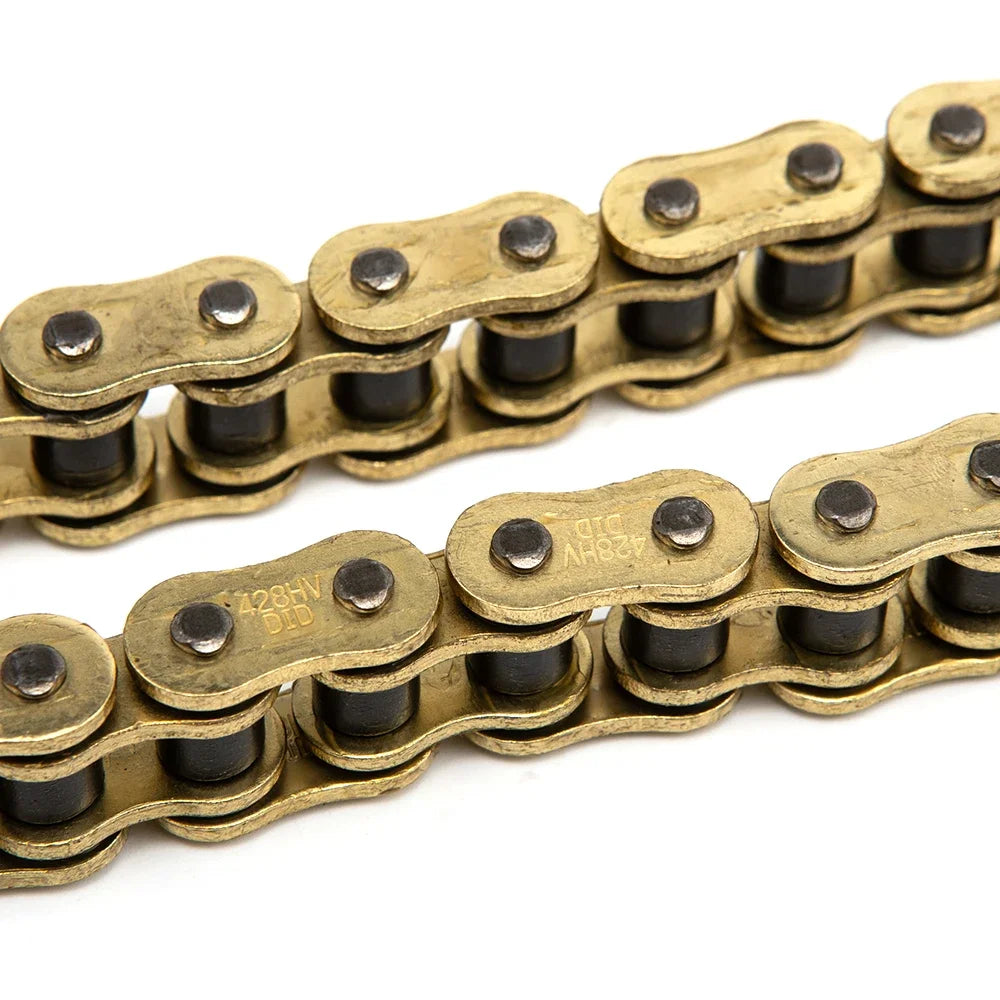 Close-up view of a heavy-duty motorcycle chain with brass links and black o-rings.