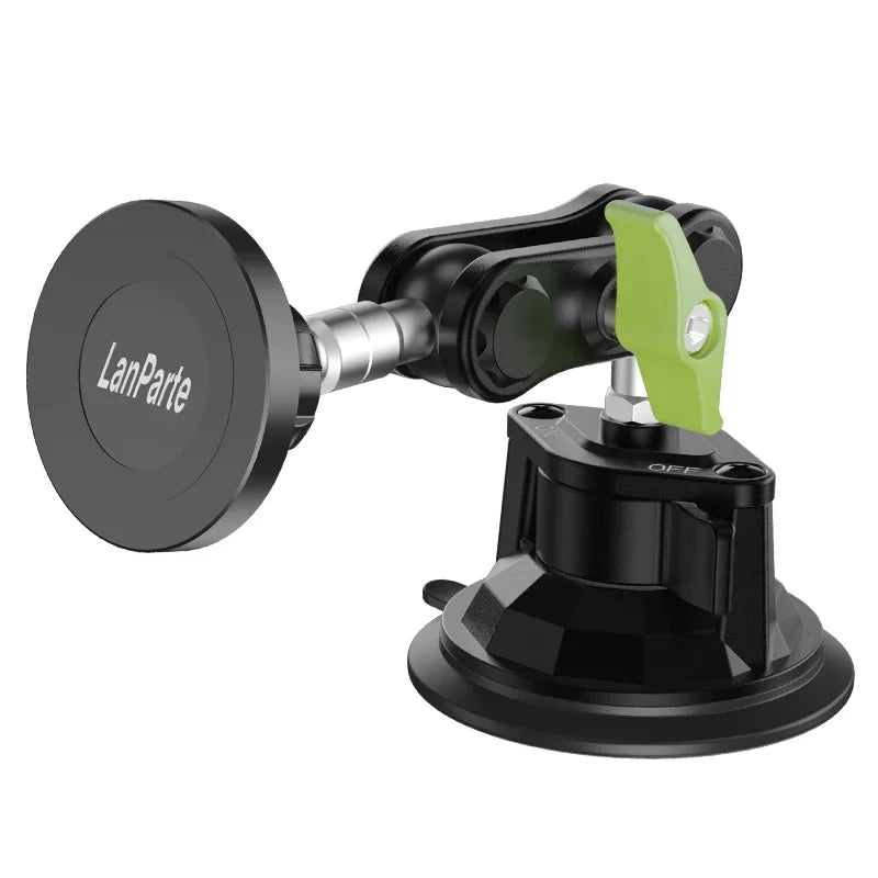 Support magnétique de téléphone noir avec mécanisme de serrage vert rotatif.