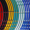 Close-up of colorful reflective wheel rim strips arranged in concentric arcs.